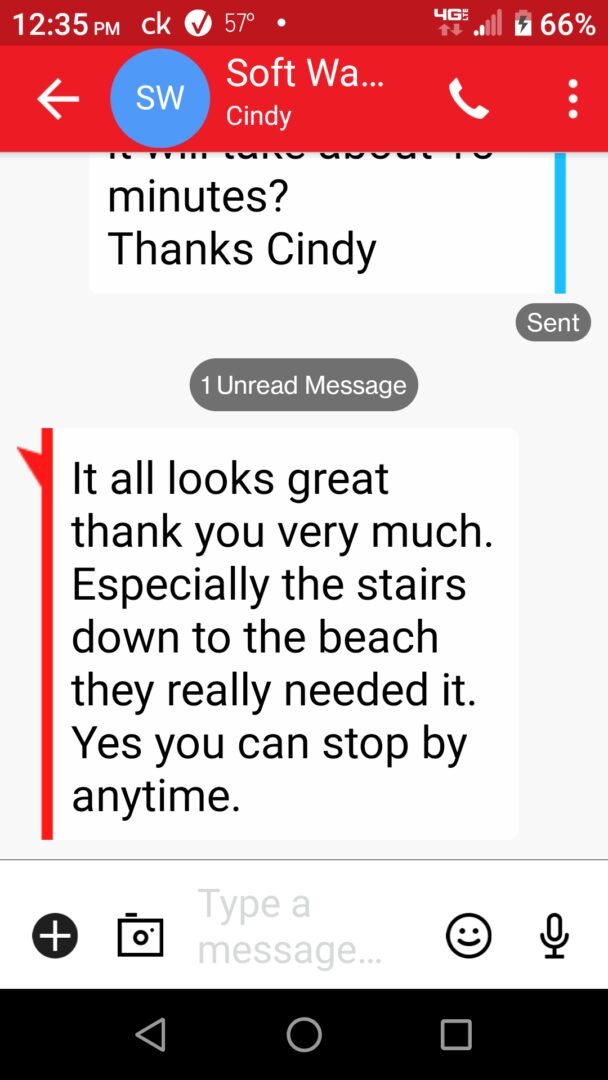 A text message with an image of a beach.