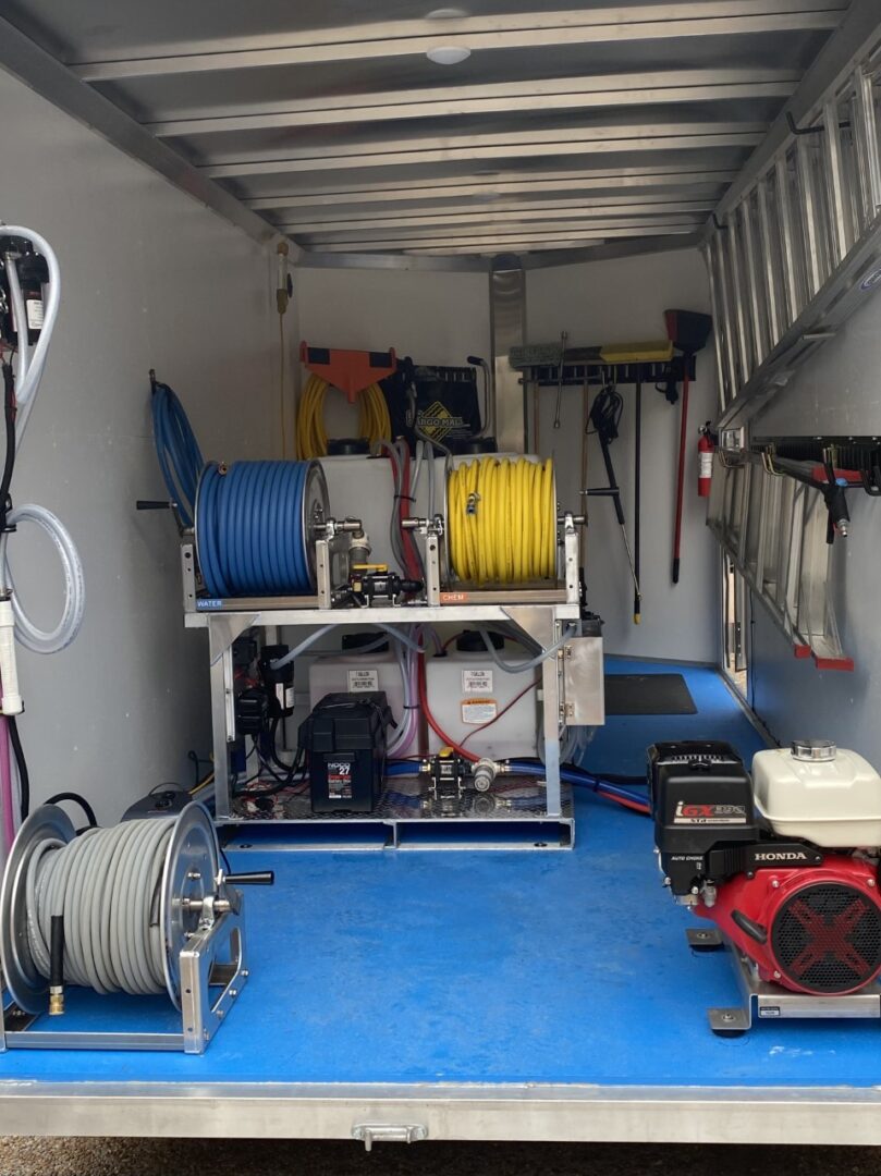 A large truck with many tools on the floor.